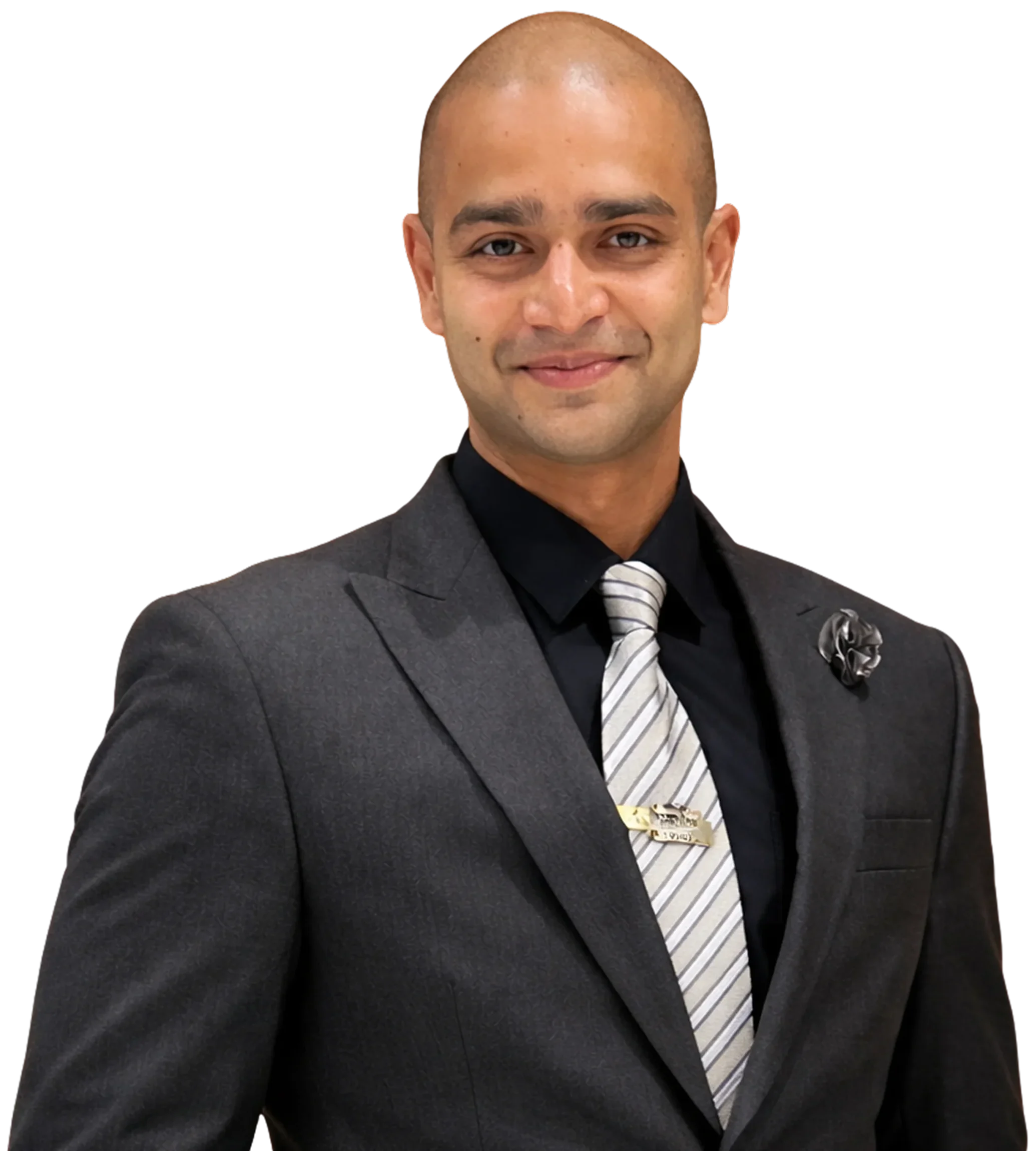 Professional portrait of male plastic surgeon in formal suit against black background.
